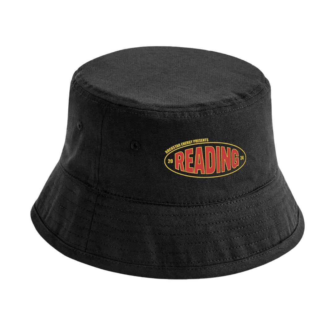The Reading Bucket Hat by Reading & Leeds Festival is a black hat with an oval patch displaying READING in bold red and yellow letters, plus smaller embroidered text above and below the patch for extra detail.