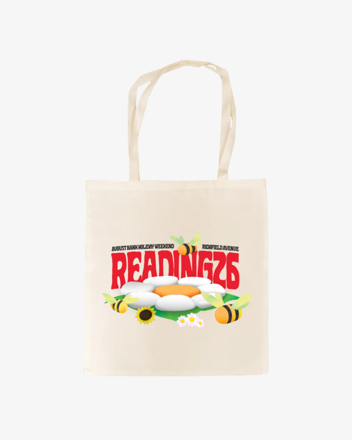 The Click & Collect Reading Tote Bag from R&L Click & Collect 2026 is a cream tote bag featuring ‘READING 2026’ in bold red text with flowers and bees surrounding it; above, smaller text reads “August Bank Holiday Weekend” and “Richfield Avenue.”.