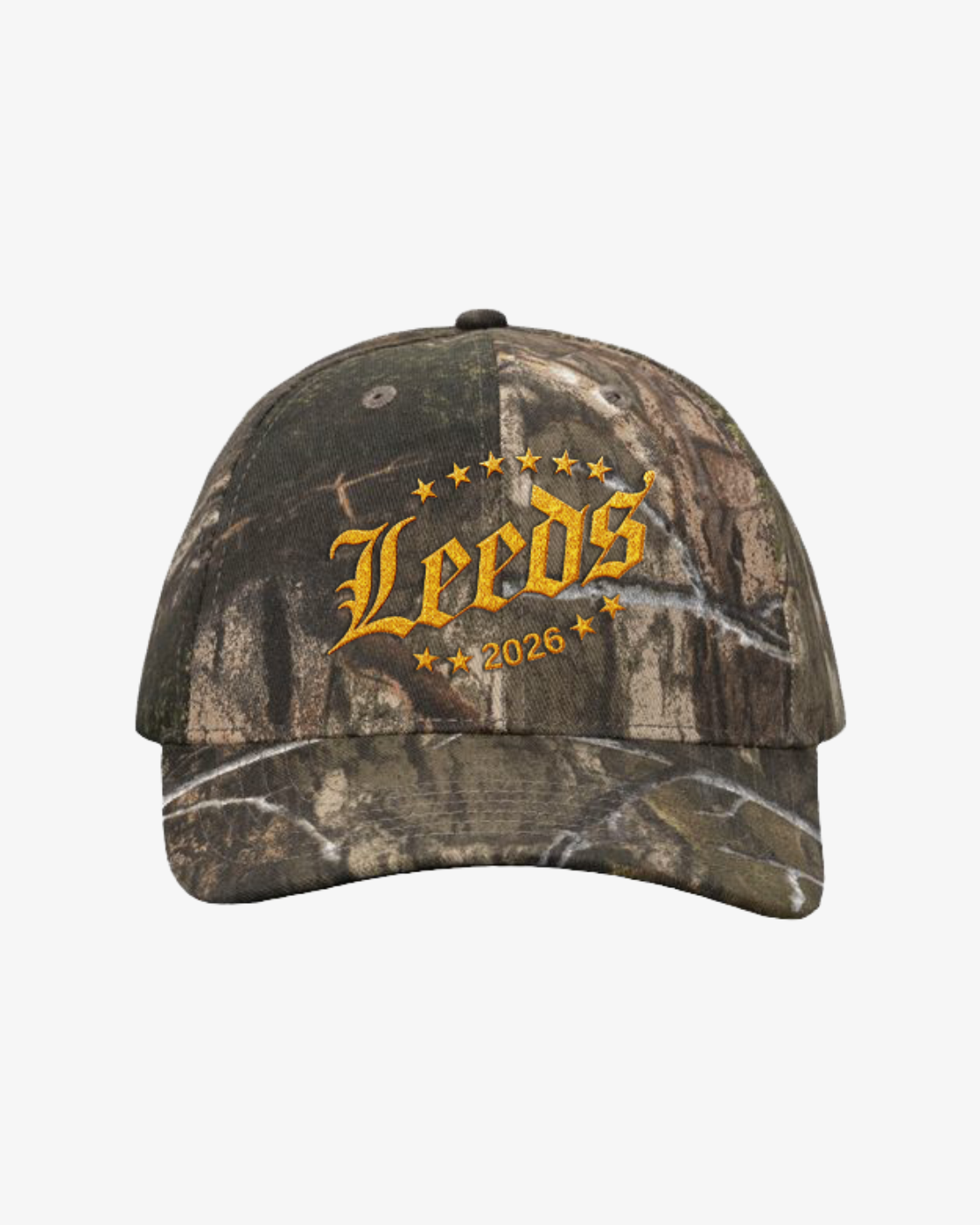 The R&L Click & Collect 2026 “Click & Collect Leeds Cap” is a camouflage baseball cap featuring “Leeds” and “2026” in yellow lettering, surrounded by yellow stars, on the front.