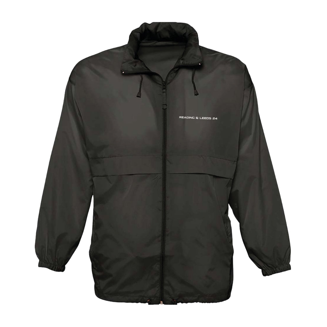 The Reading & Leeds Festival Rain Coat is a black zip-up windbreaker with a high collar, drawstrings, elastic cuffs, and READING & LEEDS 24 on the left chest. Relaxed fit and shown against a white background—ideal festival outerwear.