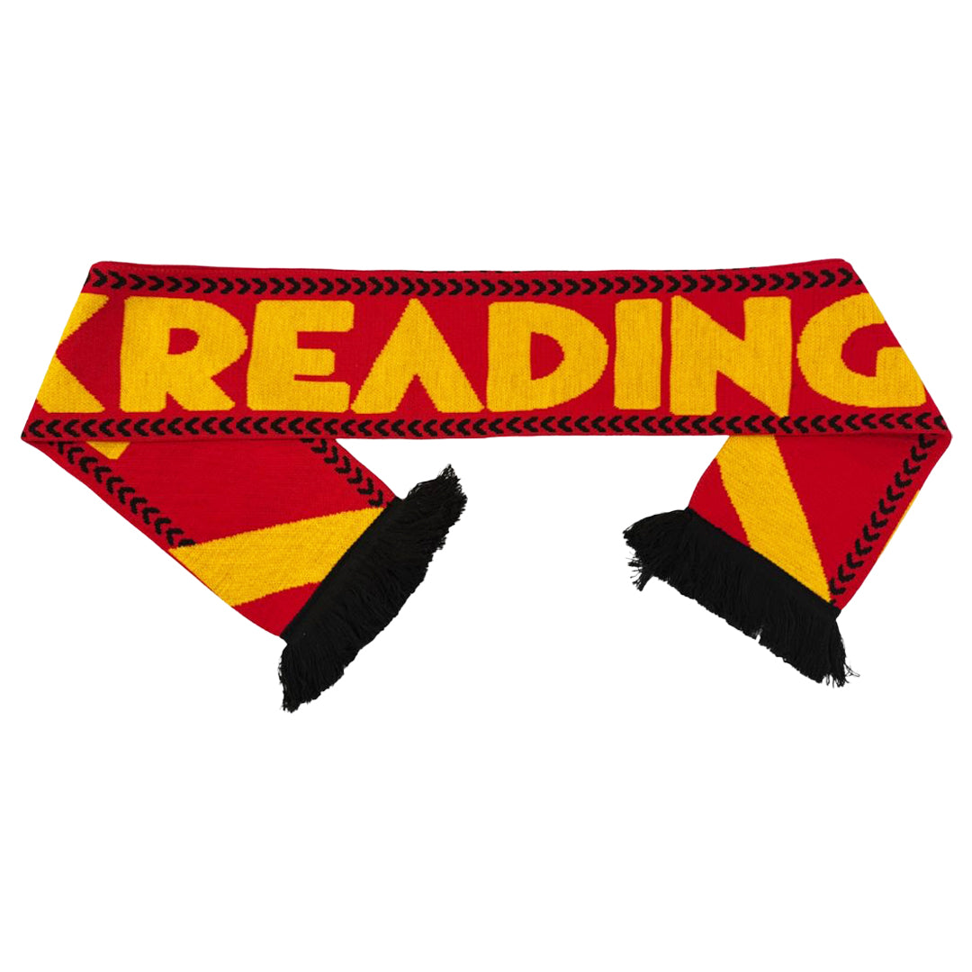 Show your festival pride with the Reading & Leeds Festival Reading Scarf—a bold red and yellow scarf featuring READING in yellow, black chevrons along the edges, and black tassels at both ends. Perfect for any passionate fan!.